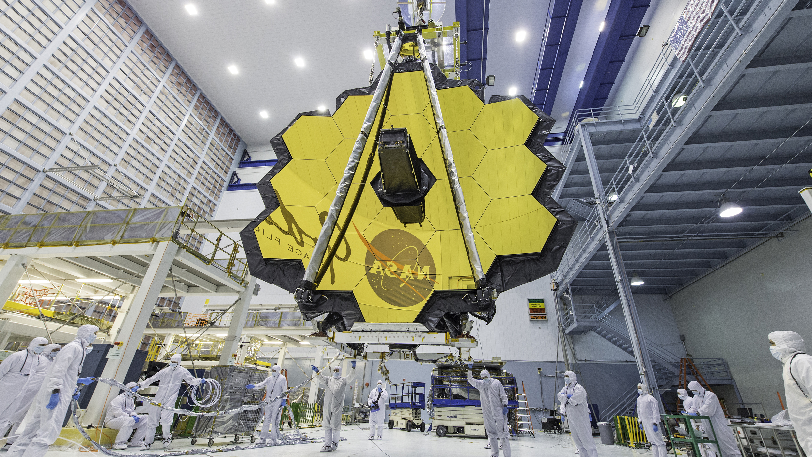 NASA technicians lift the James Webb Space Telescope using a crane at NASA’s Goddard Space Flight Center in Greenbelt, Maryland prior to launch. Photo Credit: NASA