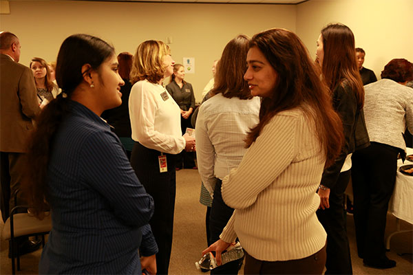 KBR employees spend time networking with one another following the official launch of ASPIRE