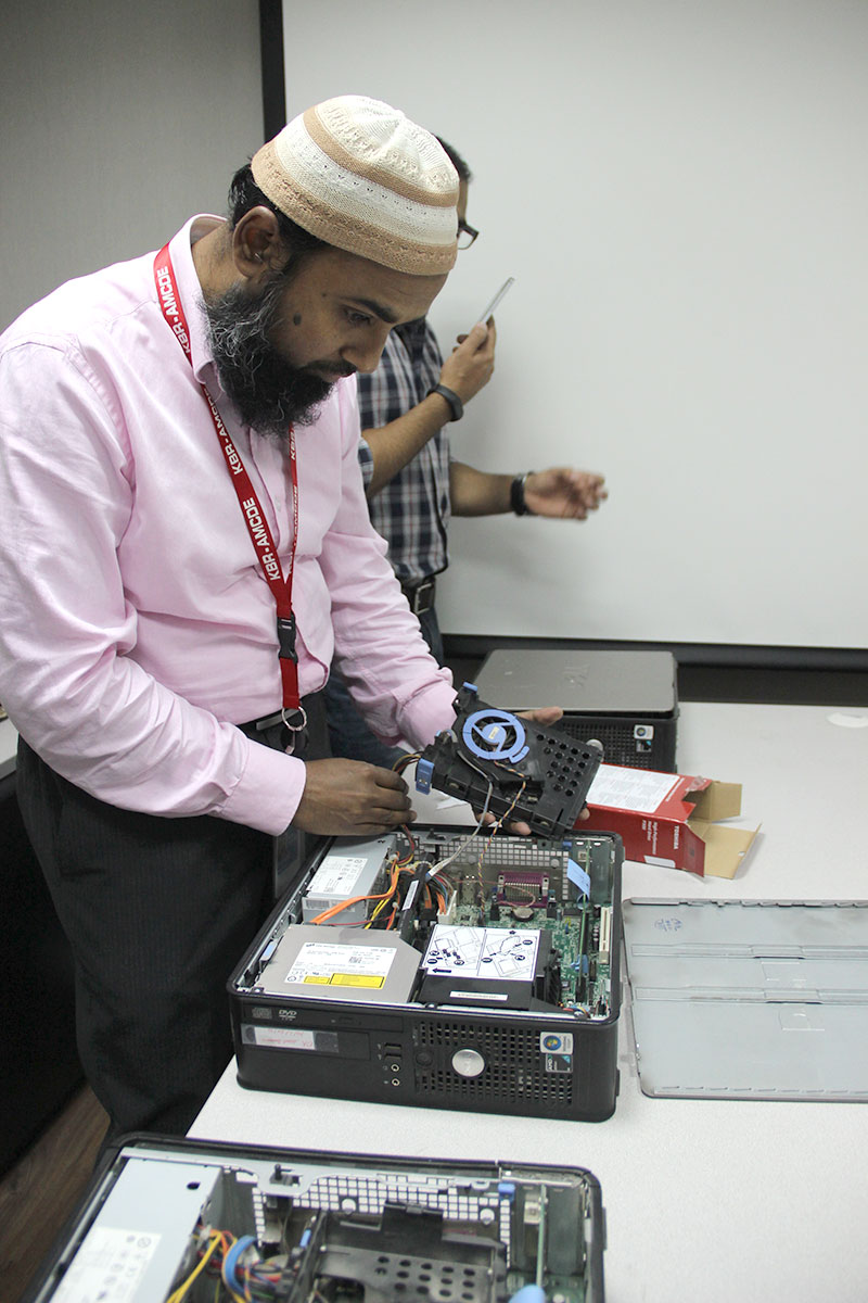 KBRs Faisal Naseem helped to replace the hard drives on used PCs in Saudi Arabia which were later donated to a local charity