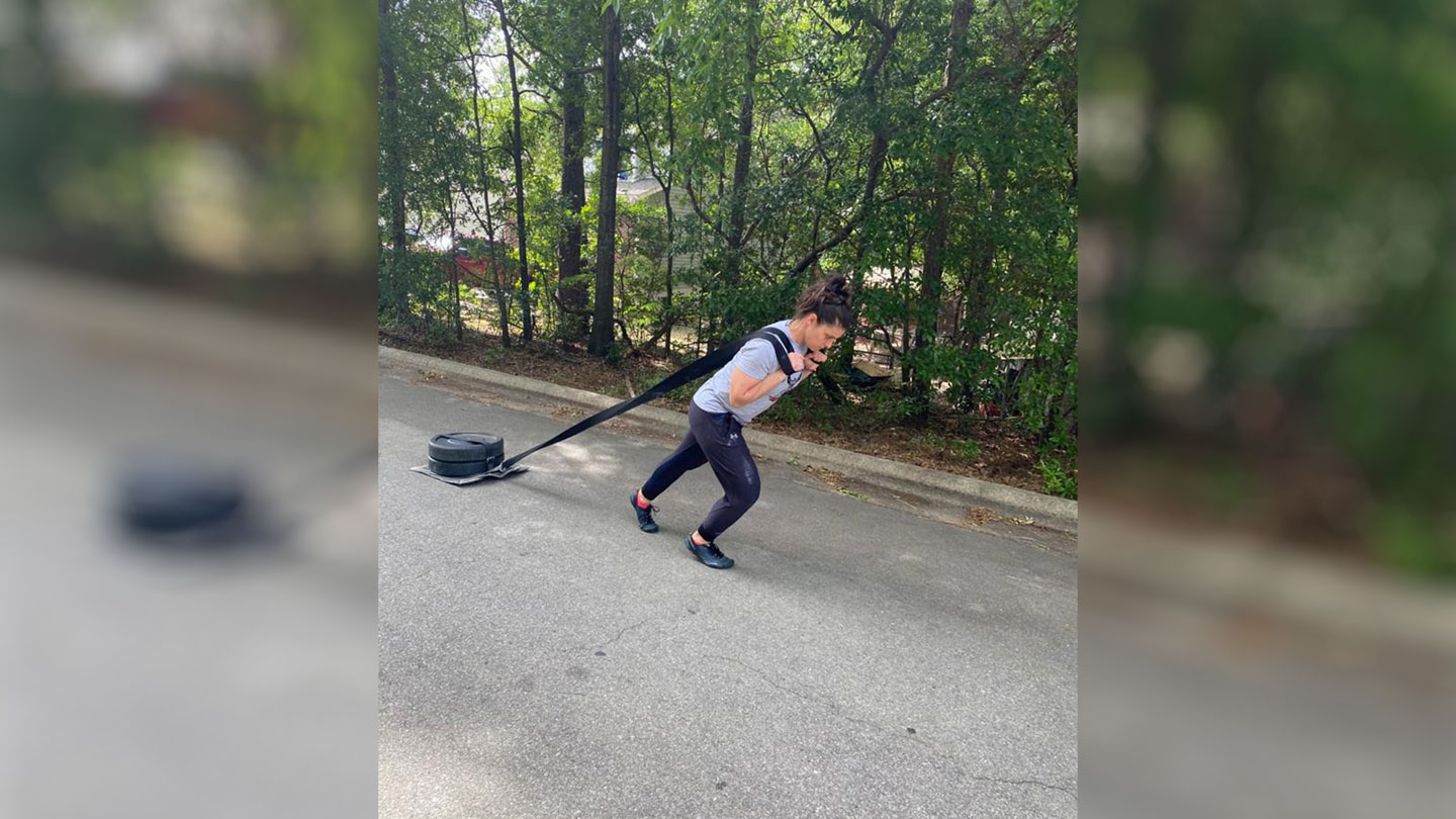 Khairallah guides an anaerobic conditioning session. Sled drags can be used to develop muscular and cardiovascular endurance, lower body strength, power, speed, as well as for recovery and restoration.
