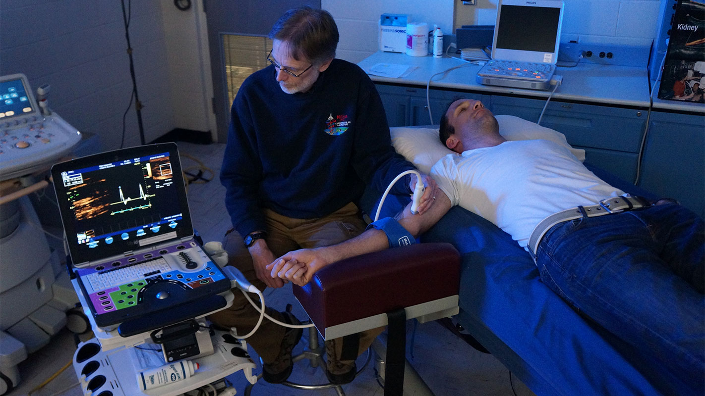 KBR’s David Martin and Steven Laurie practice vascular ultrasound procedures.