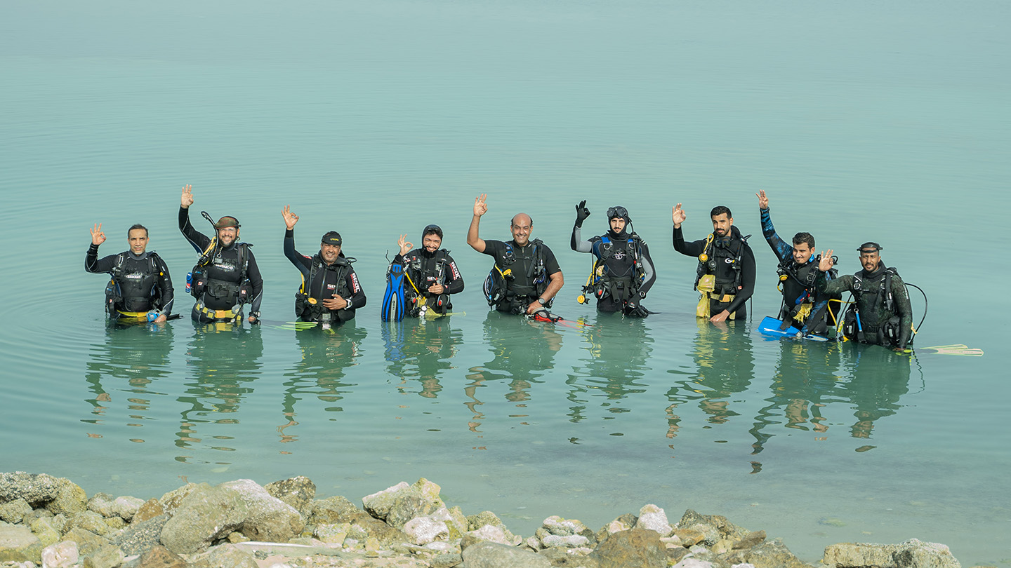Volunteer divers clean lake