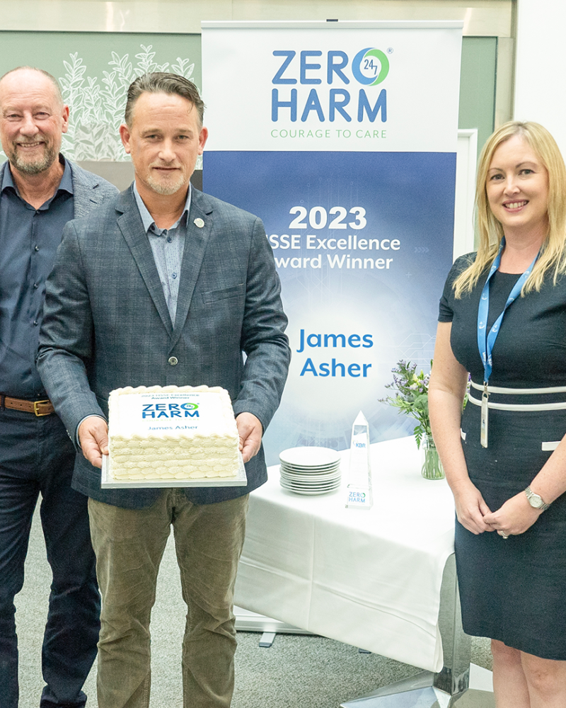 KBR CEO HSSE Excellence Award winner James Asher holding cake
